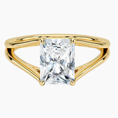 Radiant cut moissanite solitaire ring with gold split shank band