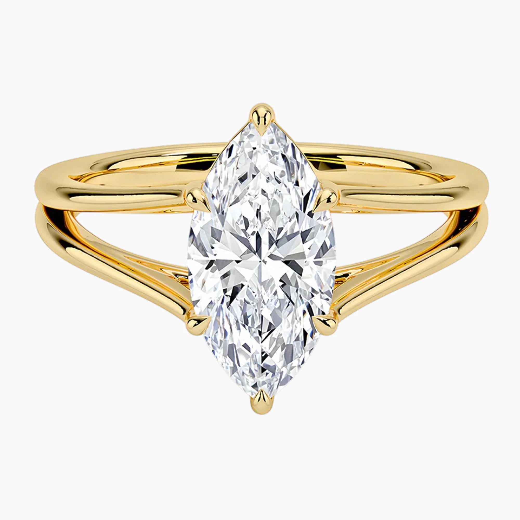 Marquise cut moissanite solitaire ring with split yellow gold band
