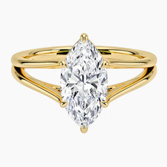 Marquise cut moissanite solitaire ring with split yellow gold band