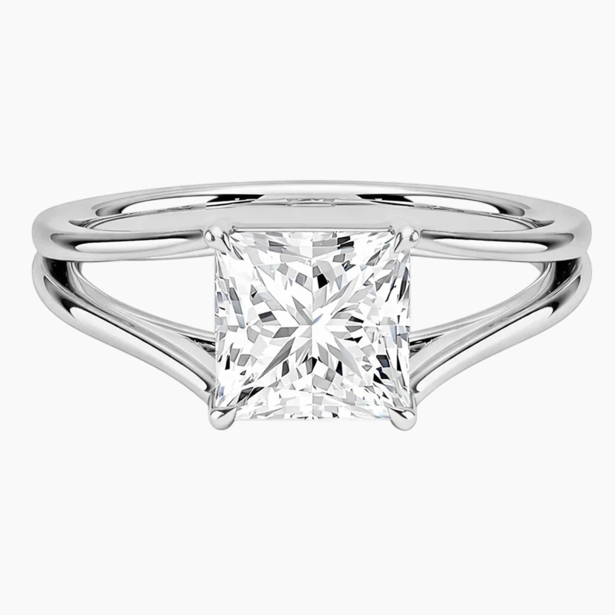 Princess cut moissanite solitaire ring with split shank in polished silver setting