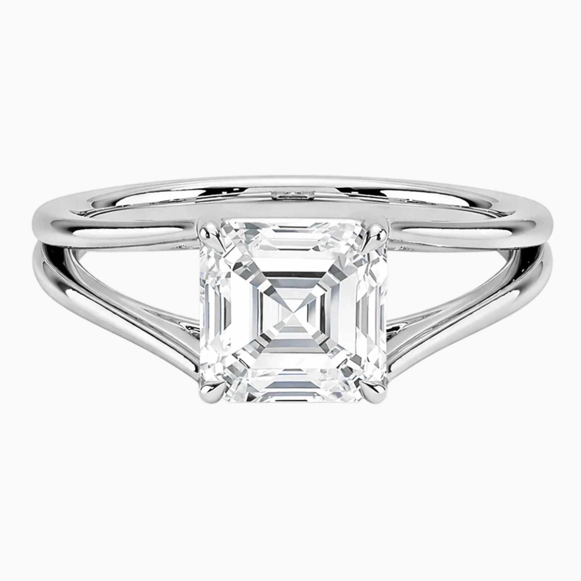 Asscher cut moissanite engagement ring with split shank in white metal setting