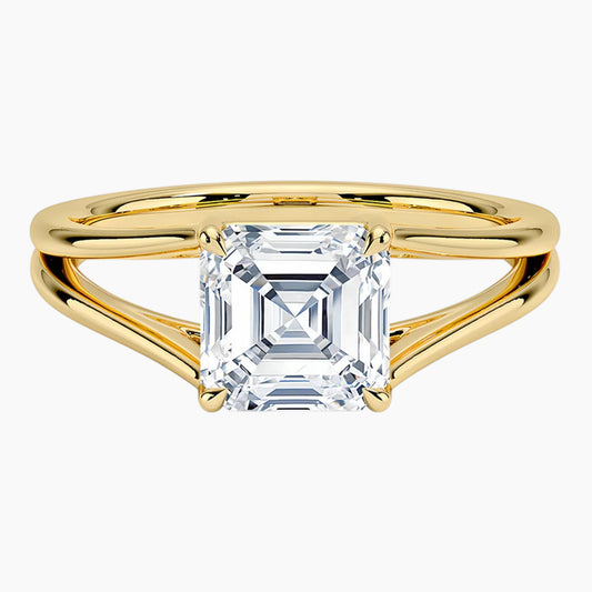 Asscher cut moissanite solitaire ring with split shank yellow gold band