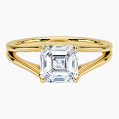 Asscher cut moissanite solitaire ring with split shank yellow gold band