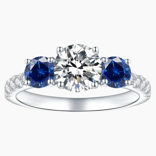 Three stone moissanite and blue sapphire engagement ring in white gold setting