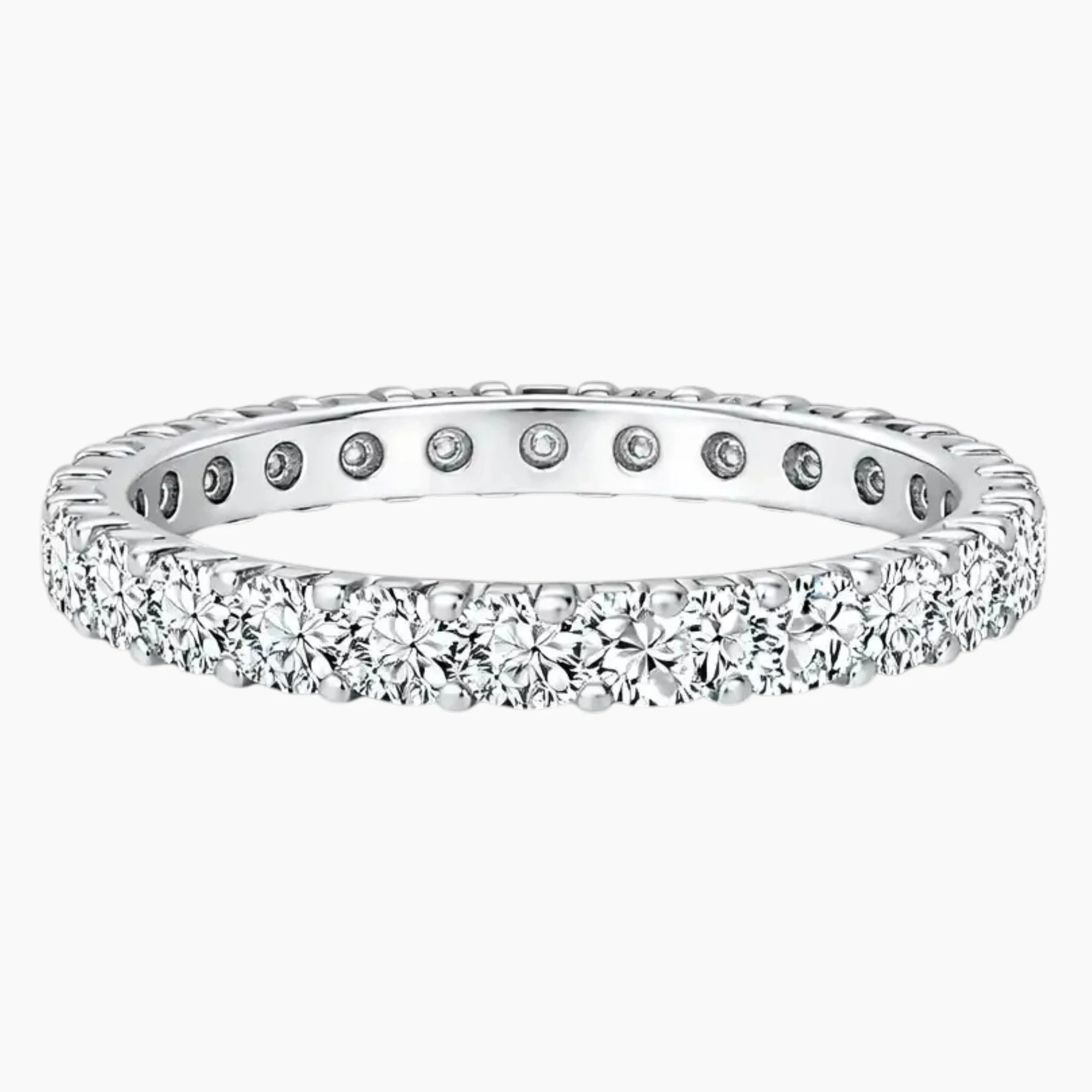 Sterling silver eternity band set with round moissanite stones, elegant fine jewelry