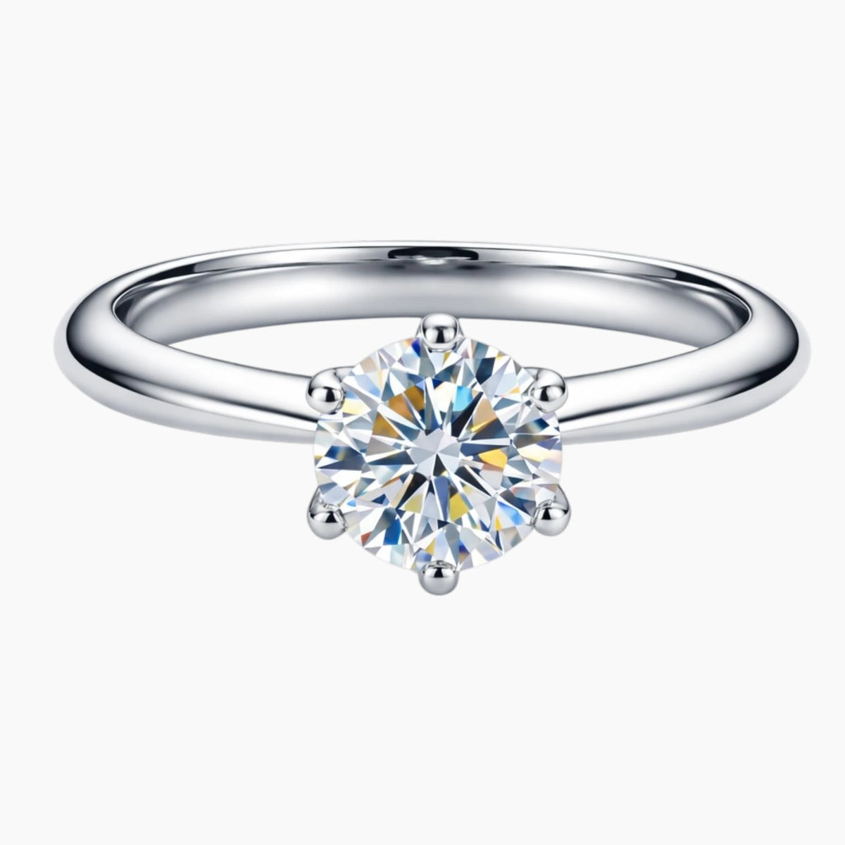 Round cut moissanite solitaire engagement ring on a silver band with six prongs