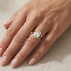 Emerald cut moissanite gold ring on hand, elegant ethical gemstone jewelry