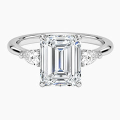 Emerald cut moissanite ring with side stones on silver gold band, luxury jewelry