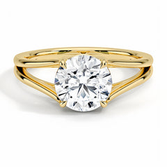 Round moissanite solitaire engagement ring with split shank yellow gold band