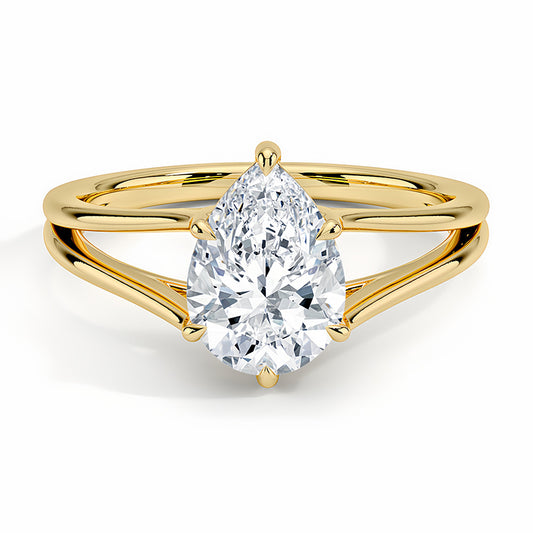 Pear-shaped moissanite solitaire ring with split gold band on white background
