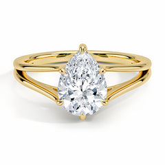 Pear-shaped moissanite solitaire ring with split gold band on white background