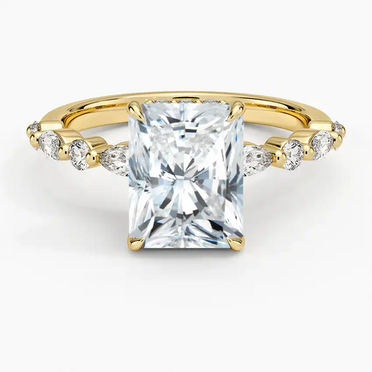 Radiant cut moissanite engagement ring with gold band and side accent stones