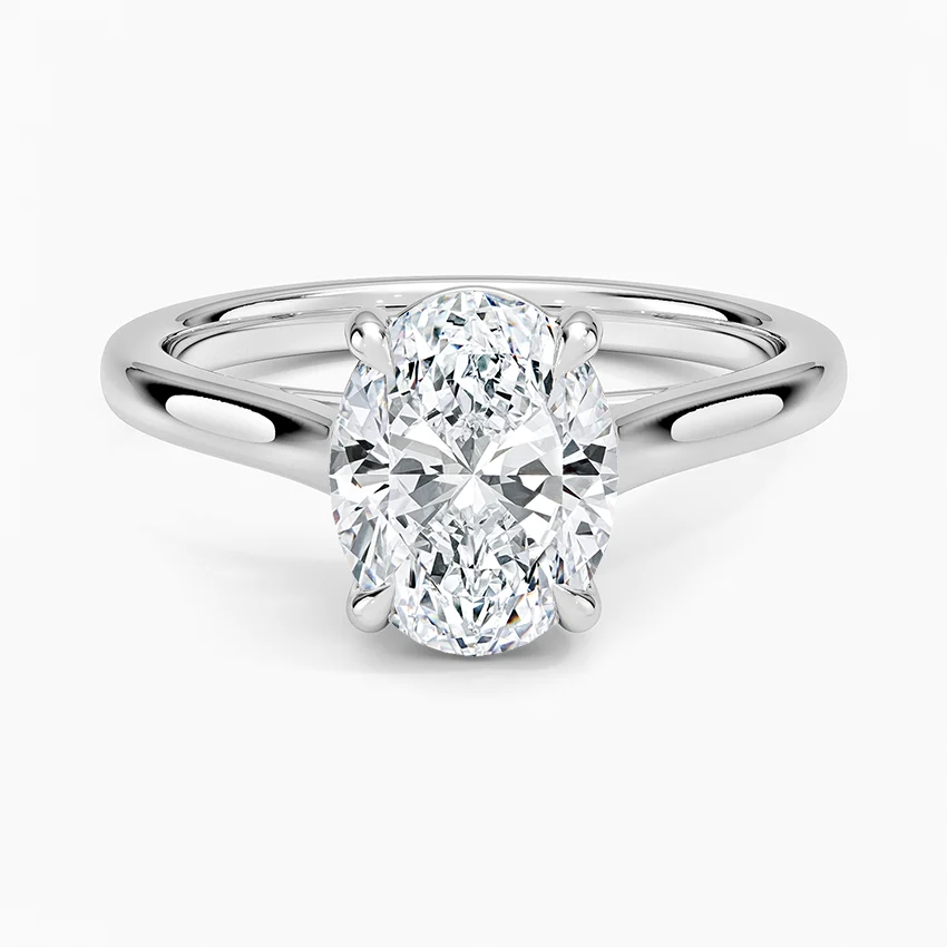 Oval cut moissanite engagement ring in a sleek silver solitaire setting