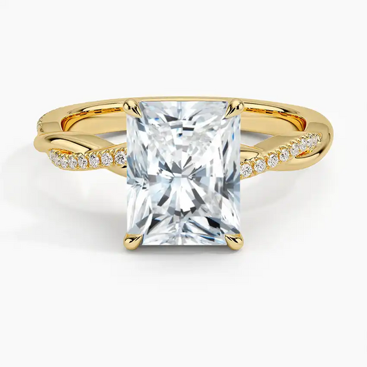 Radiant cut moissanite engagement ring with gold twisted band and pavé side stones