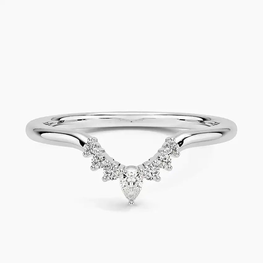 Pear-shaped moissanite accent ring in polished silver setting on white background