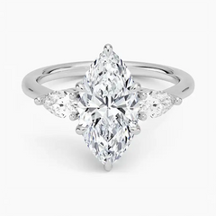 Marquise cut moissanite engagement ring with side stones in white gold setting