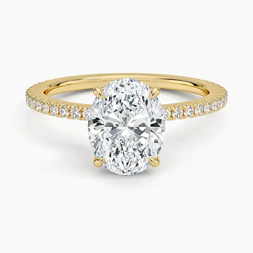 Oval cut moissanite engagement ring with pavé gold band, ethical fine jewelry
