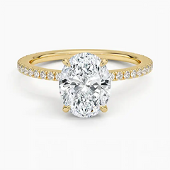 Oval cut moissanite engagement ring with pavé gold band, ethical fine jewelry