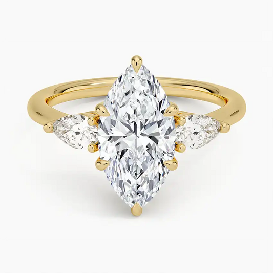 Marquise cut moissanite ring with side stones set in yellow gold