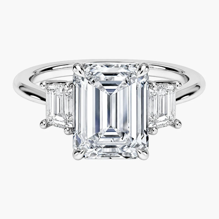 Sophisticated Emerald Cut Moissanite Trilogy Ring in Eco-Friendly White Gold
